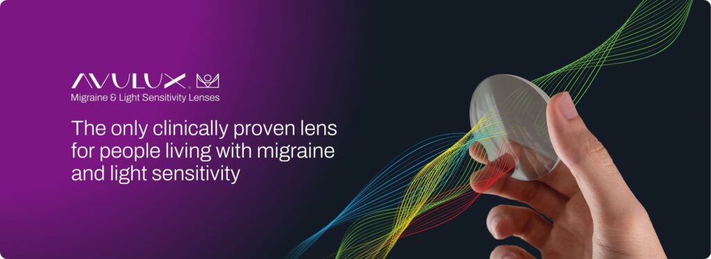 Close-up of Avulux migraine light filtering lenses blocking harsh blue light in a lab demo